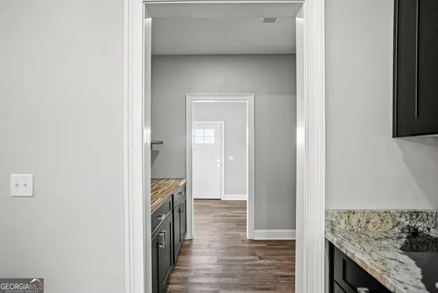 a view of hallway with washer and dryer