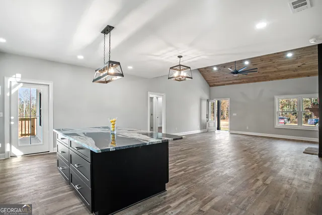 a kitchen with a sink and chandelier
