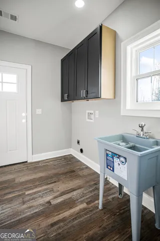 a kitchen with a sink and cabinets