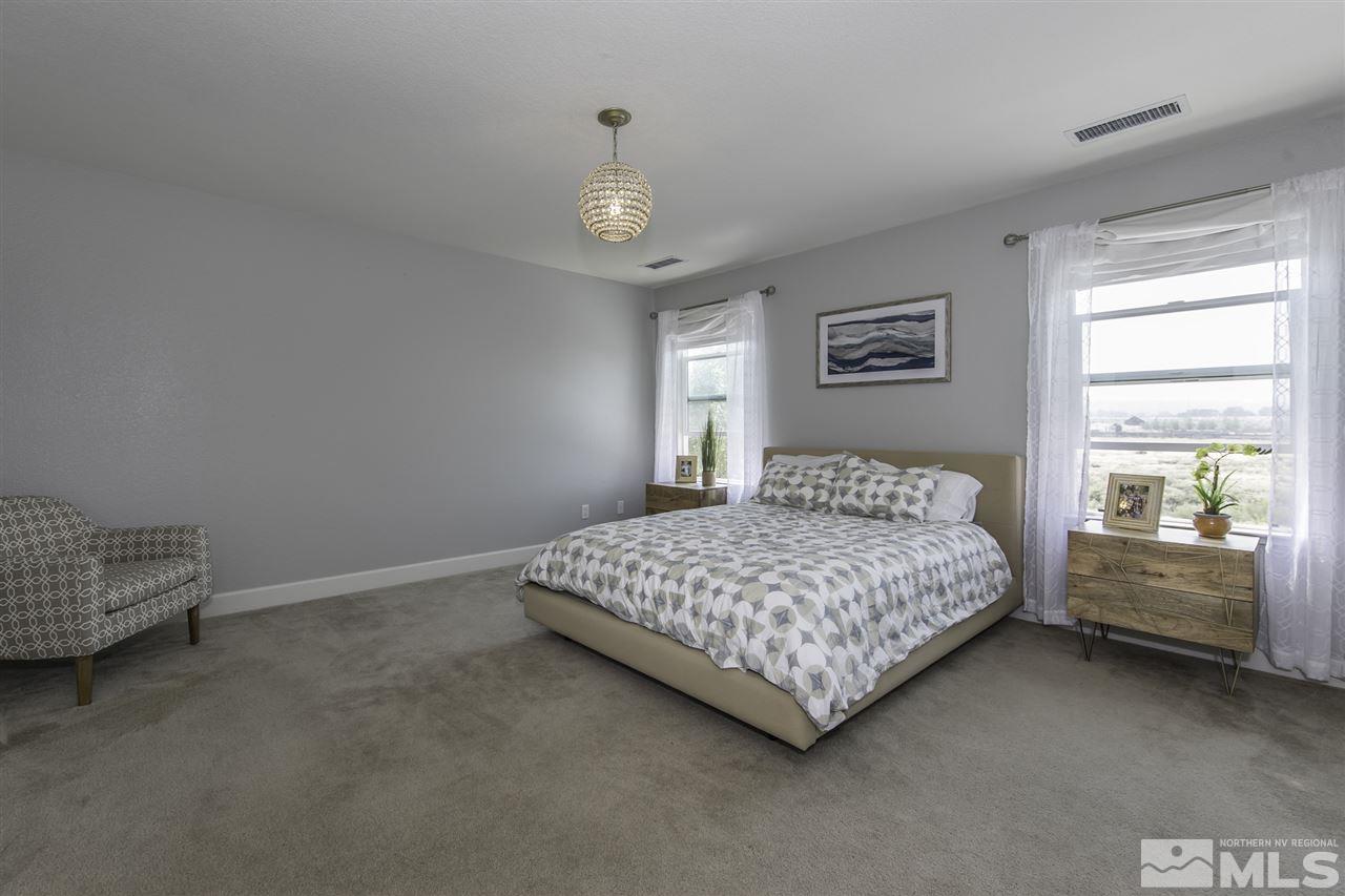 11305 Verazae Drive Reno, NV 89521 - Photo 15 of 25 a bedroom with a bed and window