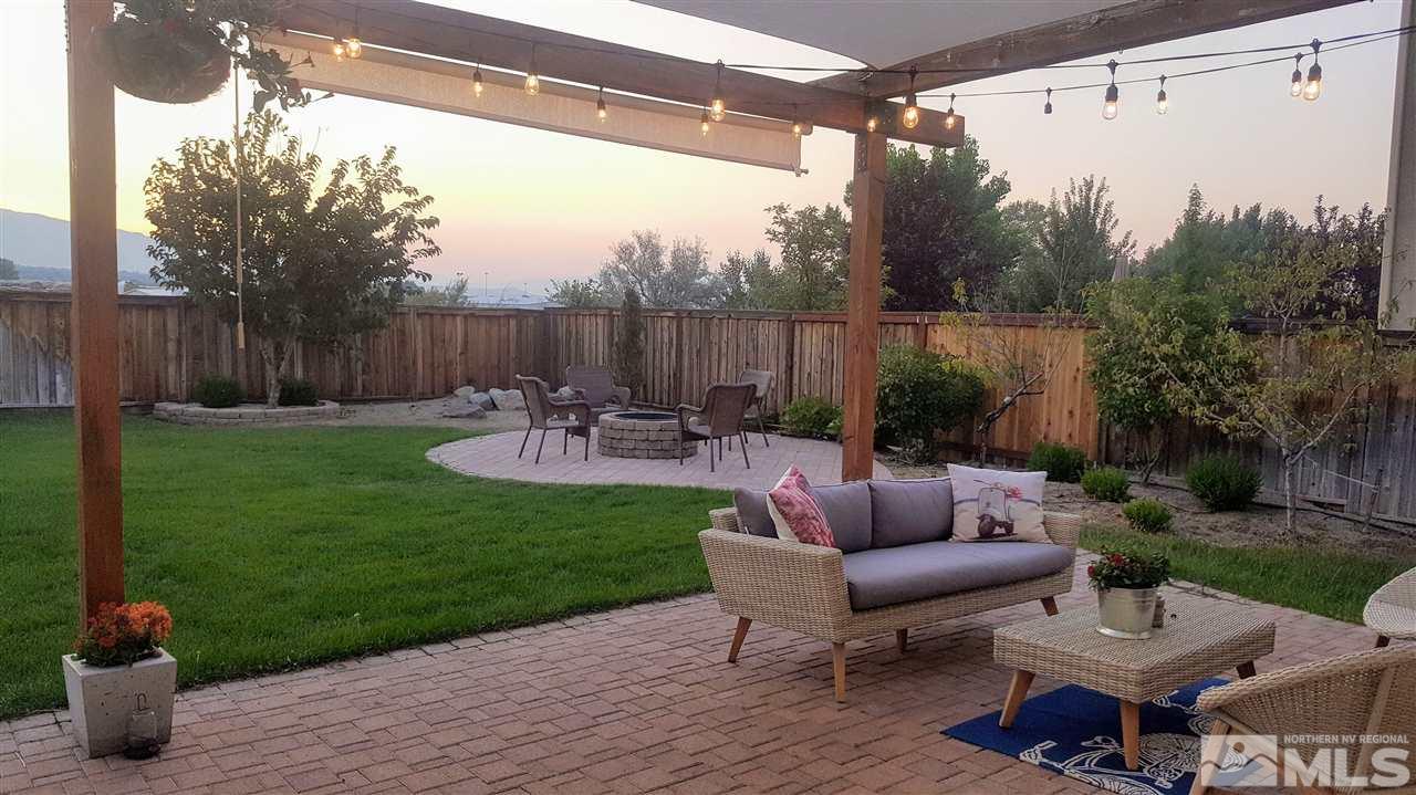 11305 Verazae Drive Reno, NV 89521 - Photo 5 of 25 a view of a backyard with sitting area and furniture