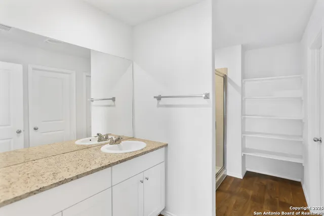 a bathroom with a sink and a mirror