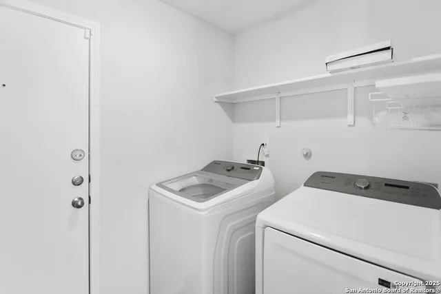 a utility room with dryer and washer