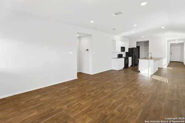 a view of a kitchen with a sink