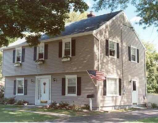 54 Shadow Ridge Road Stamford, CT 06905 - Photo 1 of 1 a front view of a house with a yard and garage