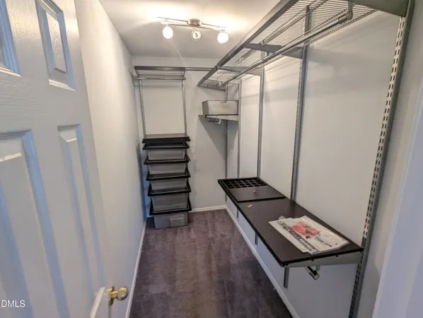 a view of a hallway with stairs