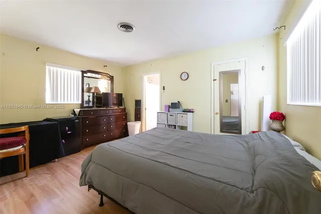 a bedroom with a bed and a dresser