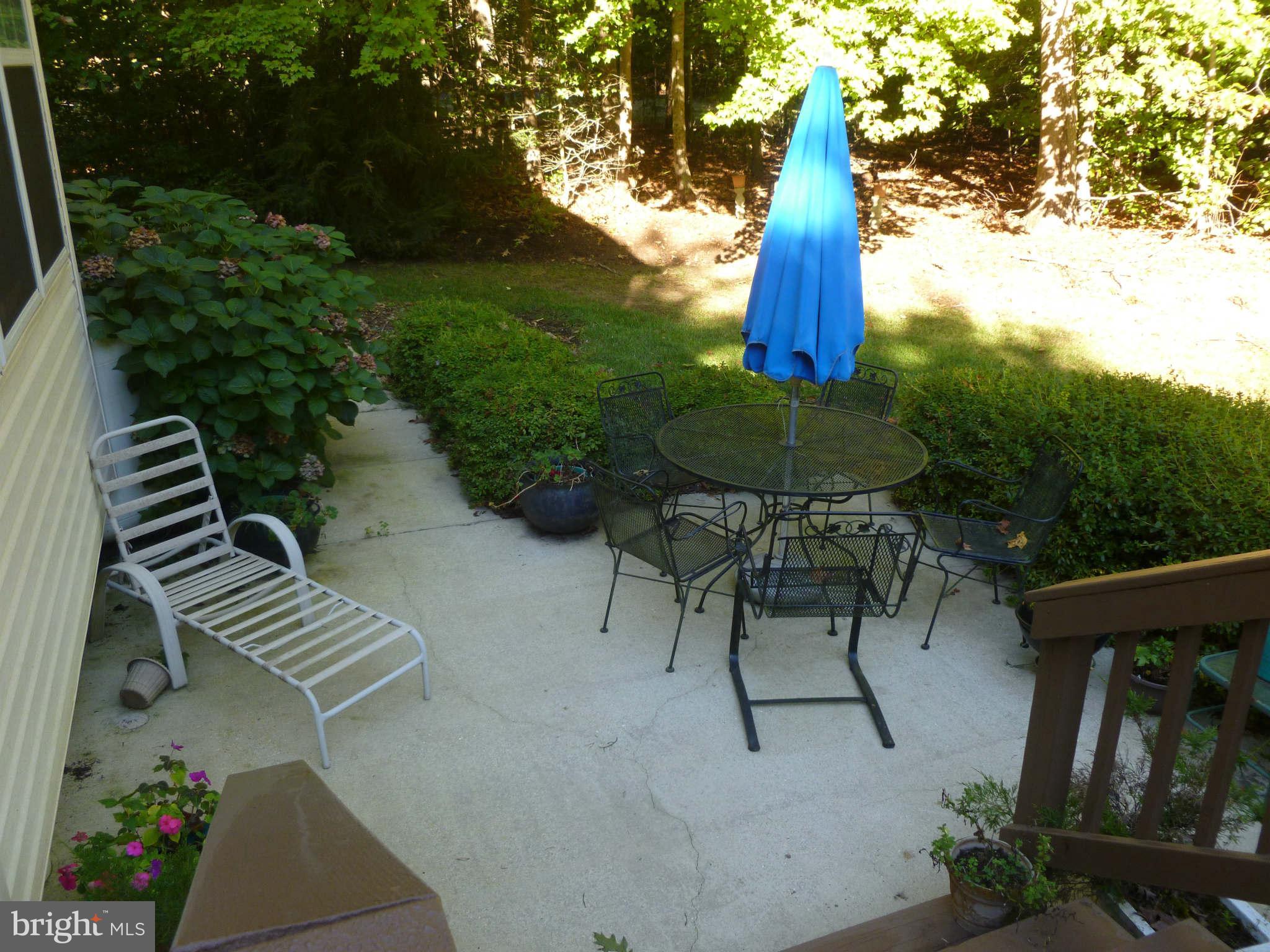 670 Small Reward Road Huntingtown, MD 20639 - Photo 21 of 26 a view of a backyard and a fountain