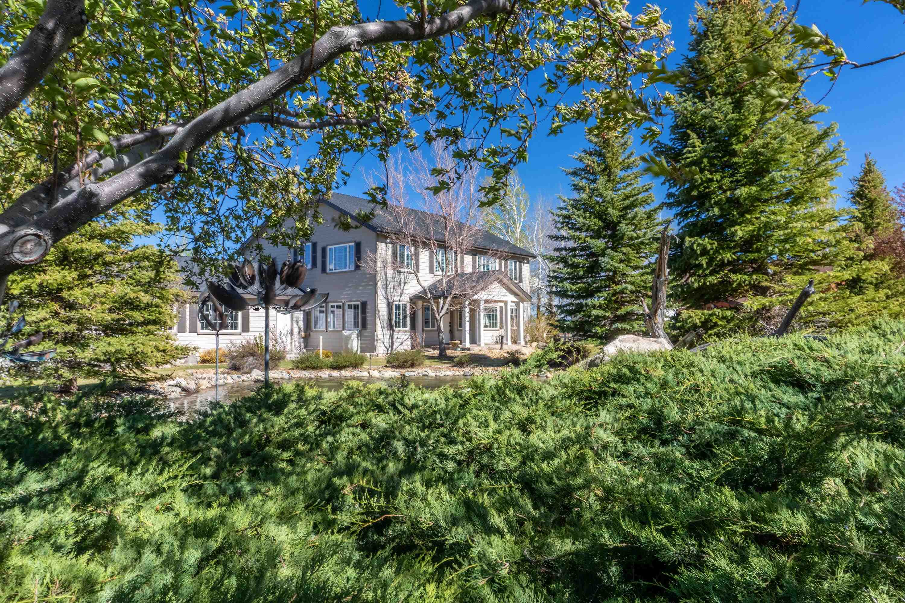 416 Wilson Creek Road Lee Vining, CA 93541 - Photo 58 of 64 a front view of a house with a tree