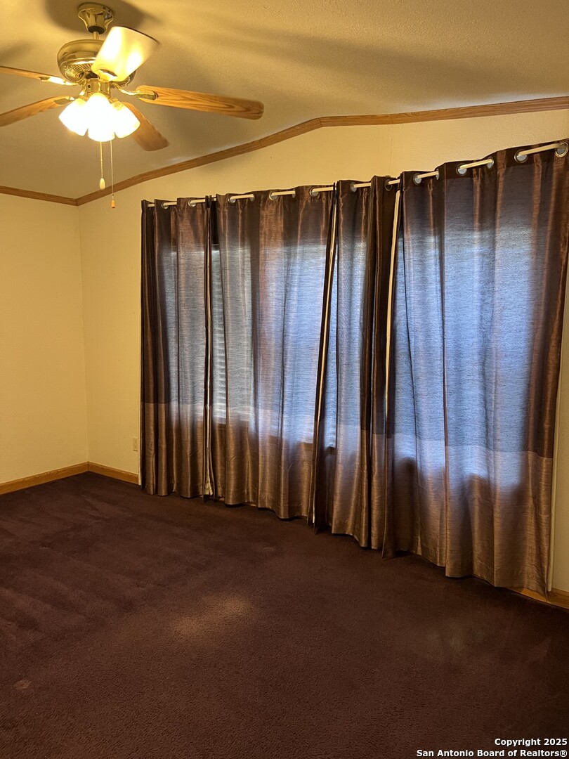 123 Chapman Street Pleasanton, TX 78064 - Photo 6 of 8 a view of outdoor space with wooden fence