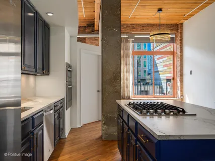 a kitchen with a stove and a sink