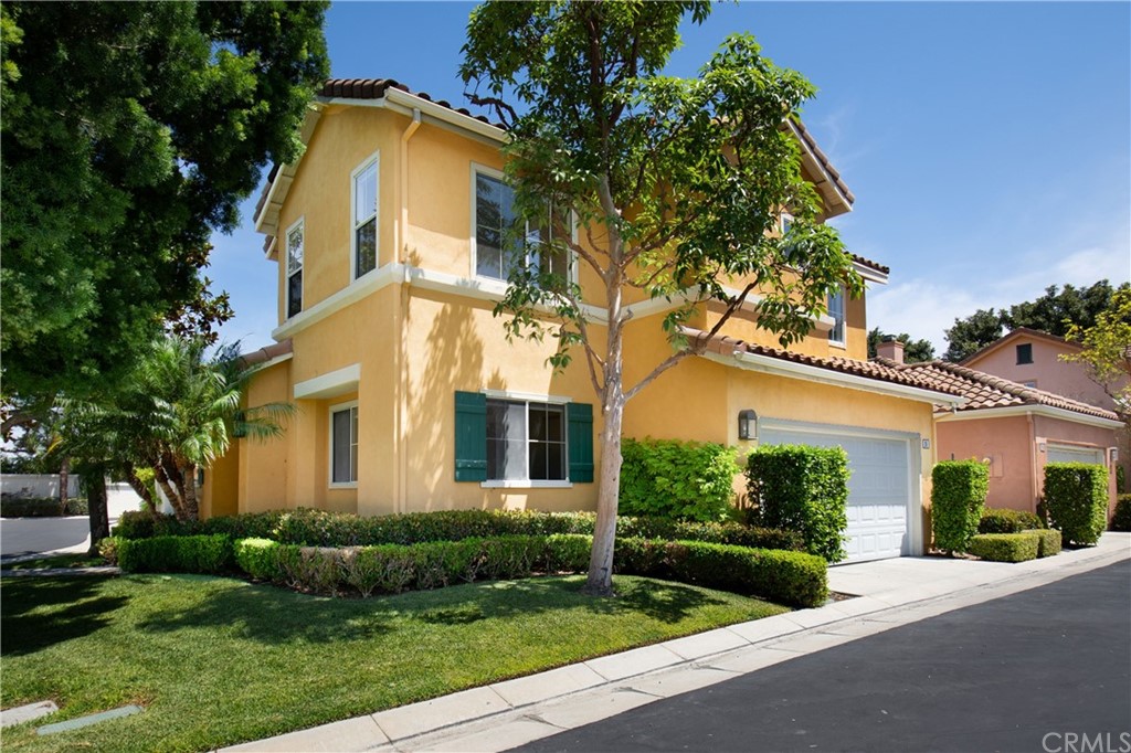 26 Le Vanto Irvine, CA 92606 - Photo 2 of 31 front view of a house with a yard