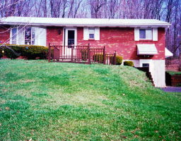 0 Off Possinger Road Stroudsburg, PA 18360 - Photo 1 of 1 a view of a brick house with a yard