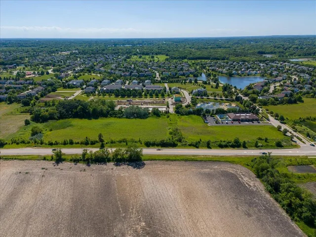 an aerial view of a city with lots of residential buildings