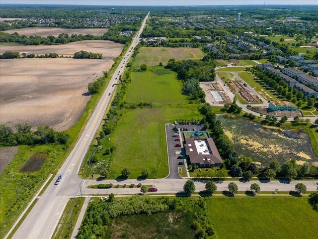 an aerial view of house with yard swimming pool and outdoor seating