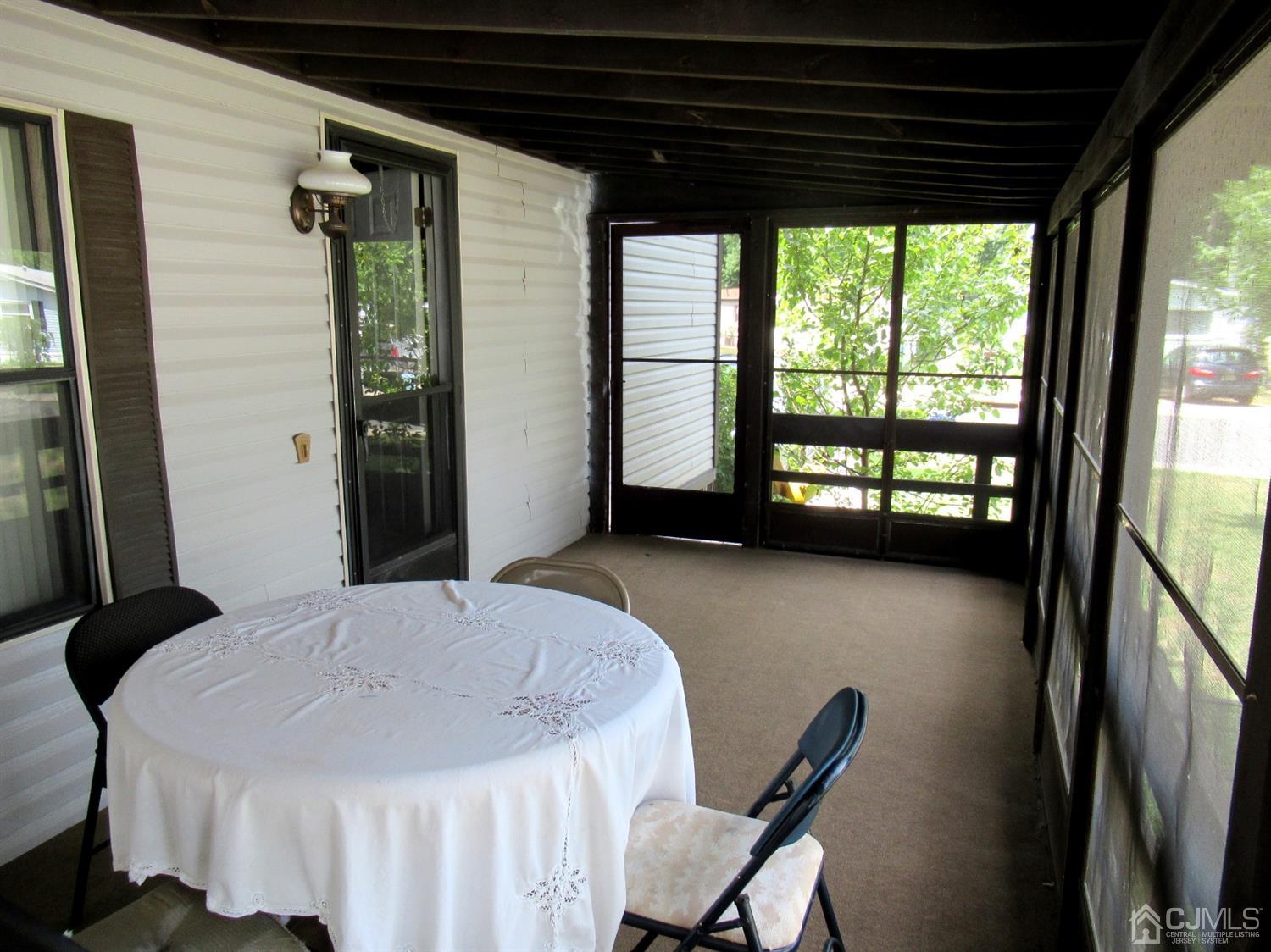 22 Emerson Road North Brunswick, NJ 08902 - Photo 3 of 14 a dining room with furniture and a floor to ceiling window
