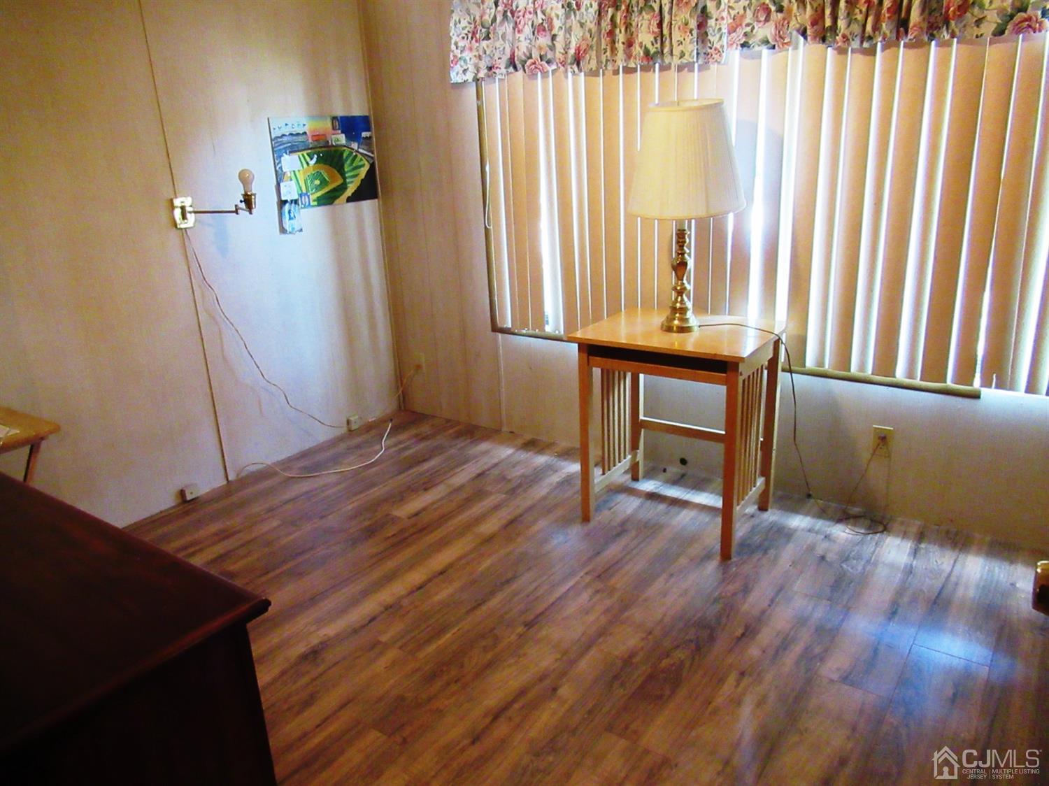 22 Emerson Road North Brunswick, NJ 08902 - Photo 5 of 14 a view of a room with a window and wooden floor