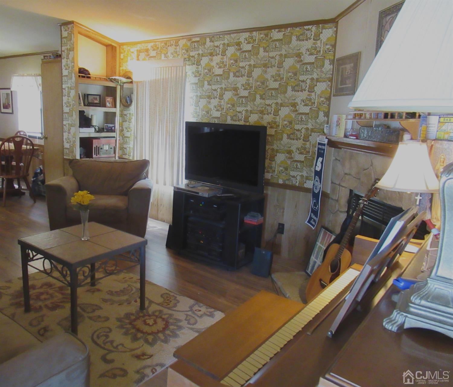 22 Emerson Road North Brunswick, NJ 08902 - Photo 7 of 14 a living room with furniture and a flat screen tv