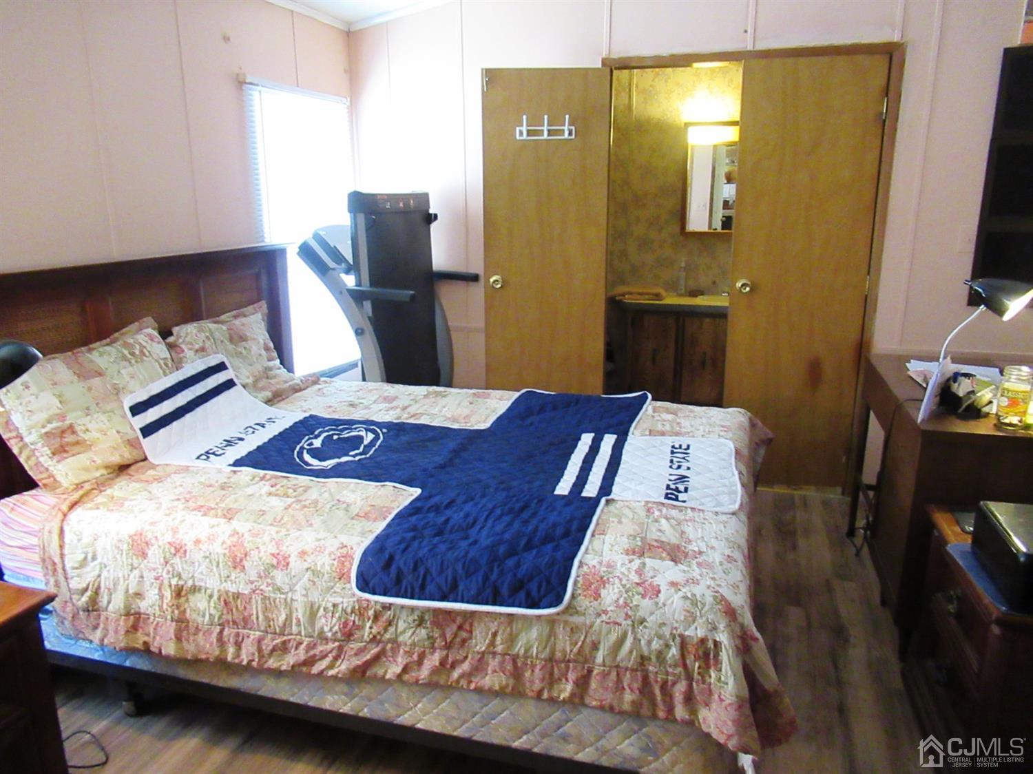 22 Emerson Road North Brunswick, NJ 08902 - Photo 10 of 14 a bedroom with a bed and dresser