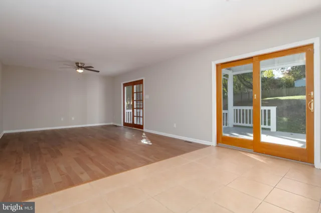 a kitchen with stainless steel appliances granite countertop wooden cabinets a refrigerator and a sink