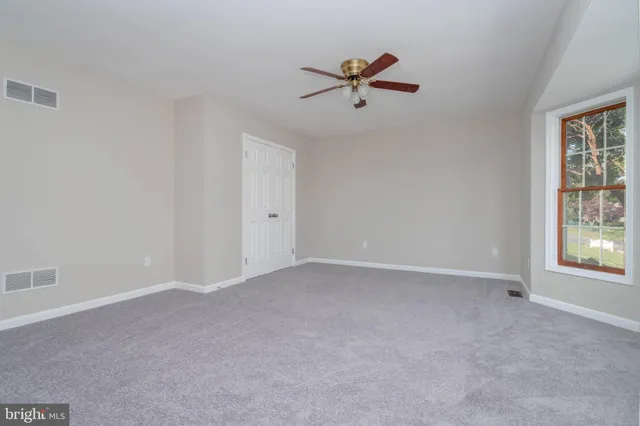 a bathroom with a sink a mirror and a shower