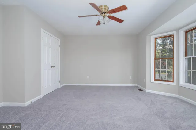 a bathroom with a toilet and a bathtub