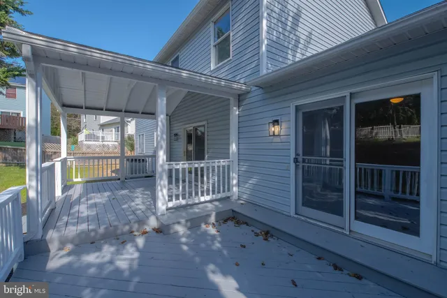 a view of a house with porch and wooden floor