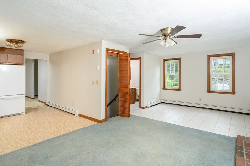 4 Easting Road Bourne, MA 02532 - Photo 17 of 42 a view of a big room with windows and chandelier fan