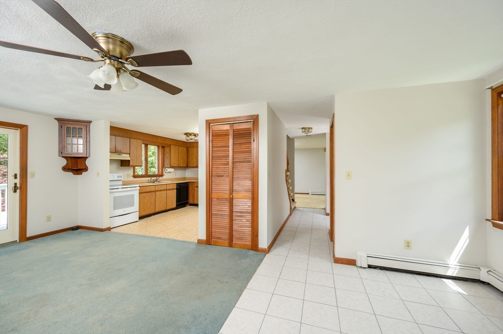 4 Easting Road Bourne, MA 02532 - Photo 20 of 42 a view of a livingroom with furniture and a kitchen