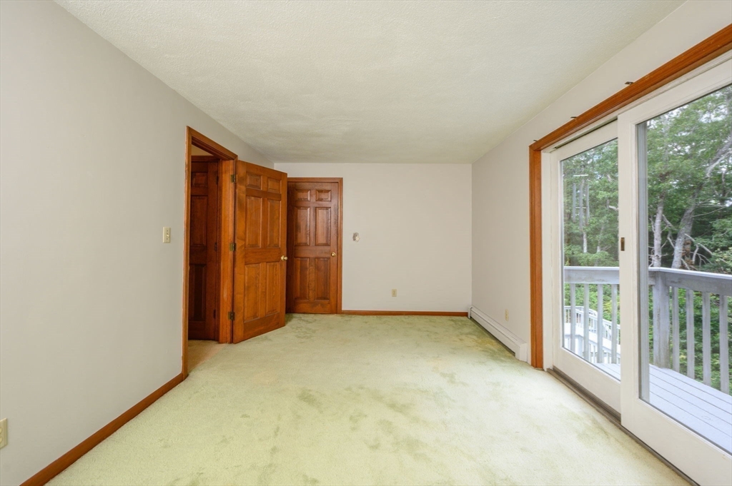 4 Easting Road Bourne, MA 02532 - Photo 25 of 42 an empty room with sliding glass door