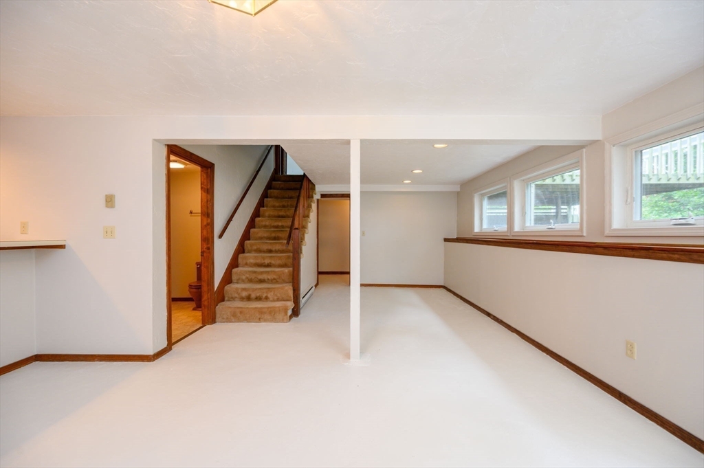 4 Easting Road Bourne, MA 02532 - Photo 28 of 42 an empty room with a window and wooden floor