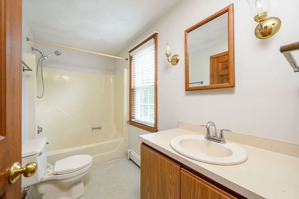 4 Easting Road Bourne, MA 02532 - Photo 8 of 42 a bathroom with a granite countertop sink toilet and shower
