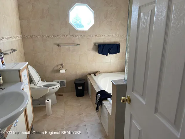 a bathroom with a toilet and a sink