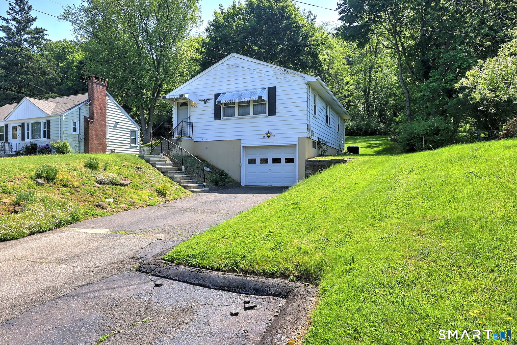 212 Swain Avenue Meriden, CT 06450 - Photo 2 of 38 a front view of house with yard and green space