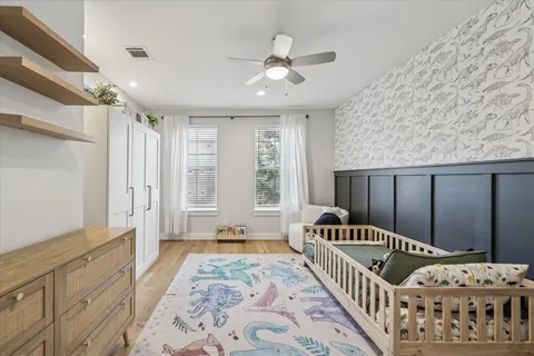 a bedroom with furniture and windows