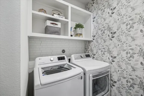 a utility room with dryer and washer