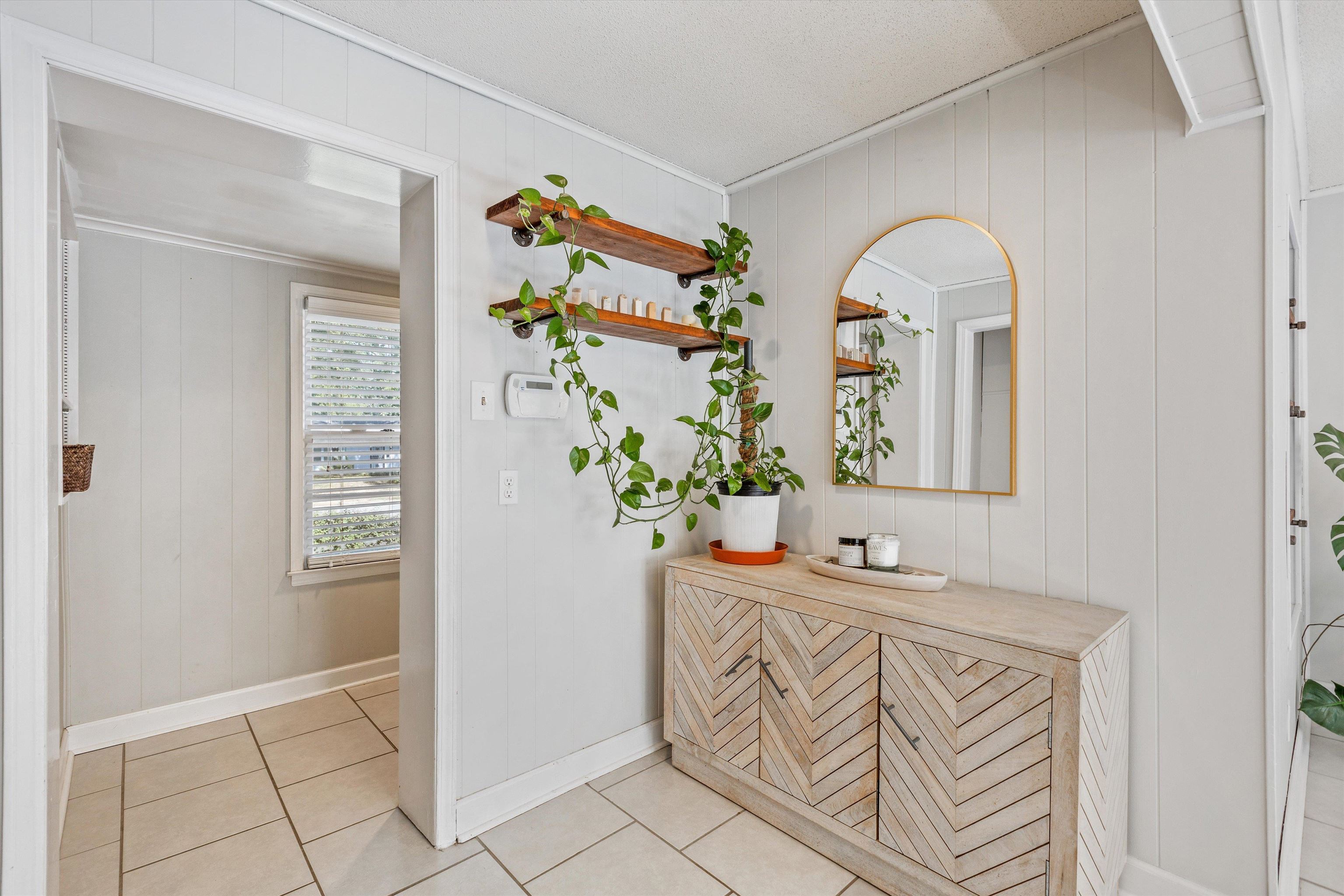 4506 Verne Road Memphis, TN 38117 - Photo 13 of 40 a bathroom with a sink a mirror and a window