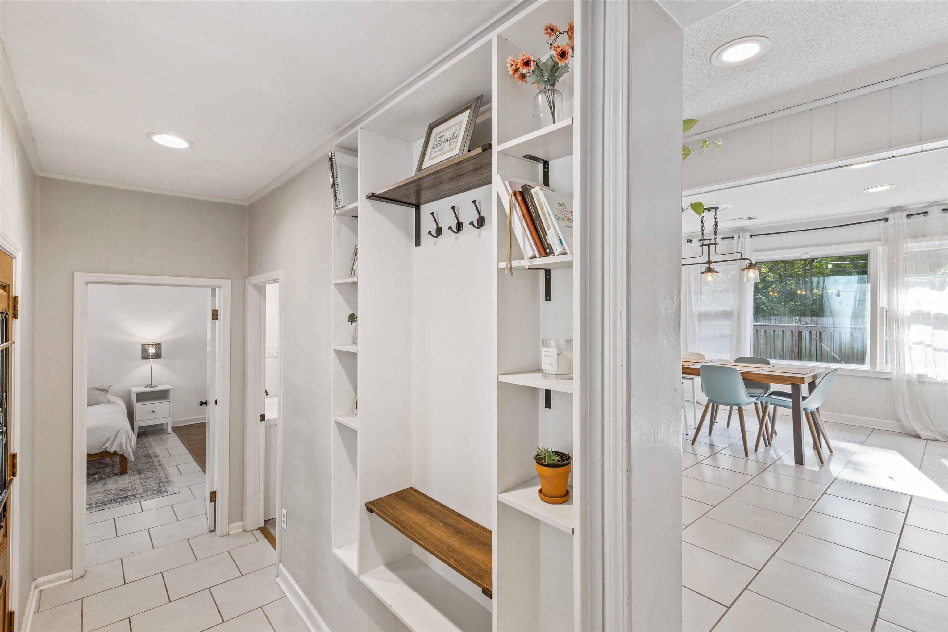 4506 Verne Road Memphis, TN 38117 - Photo 14 of 40 a view of a hallway with dining room and glass door