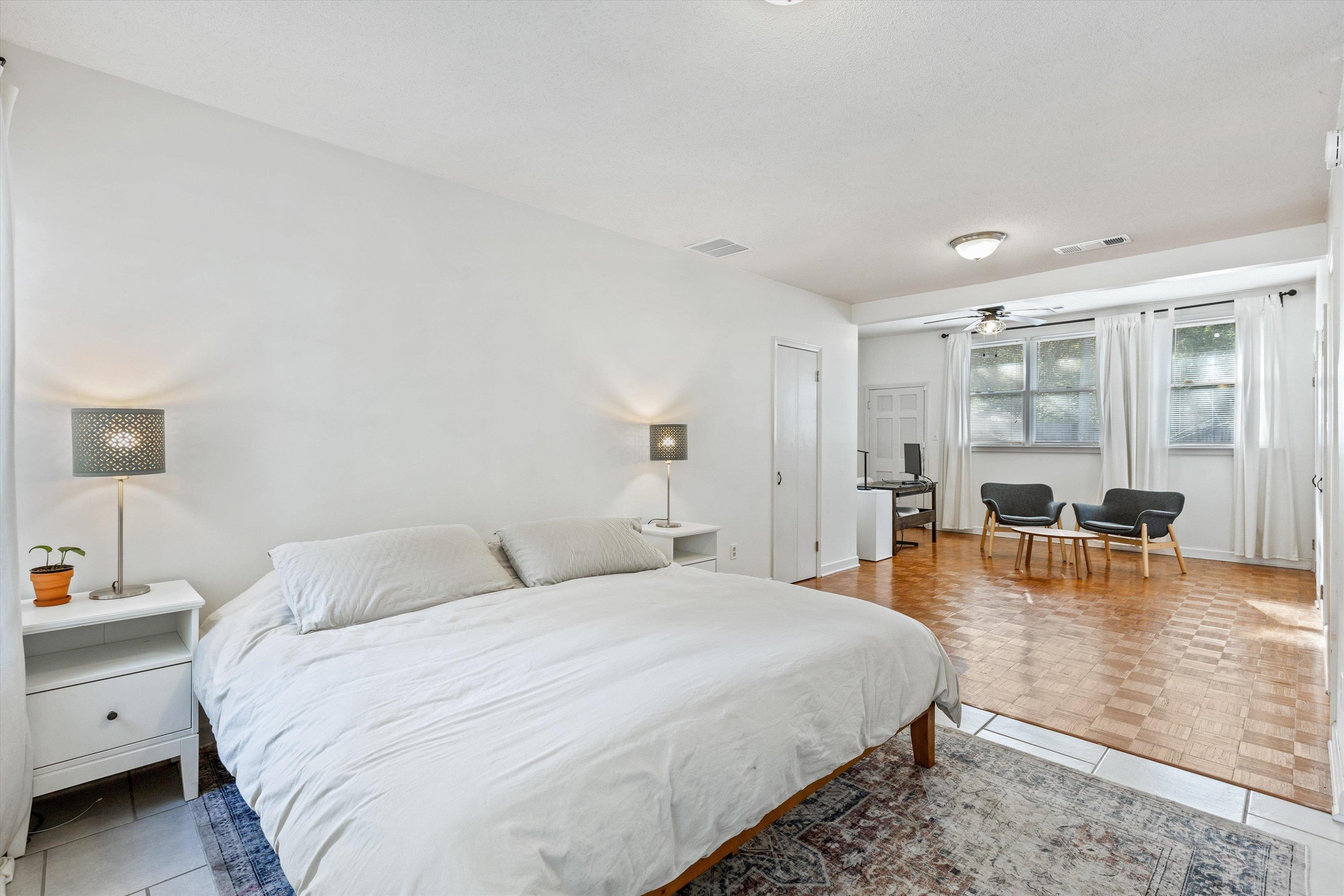 4506 Verne Road Memphis, TN 38117 - Photo 15 of 40 a bedroom with a bed and wooden floor