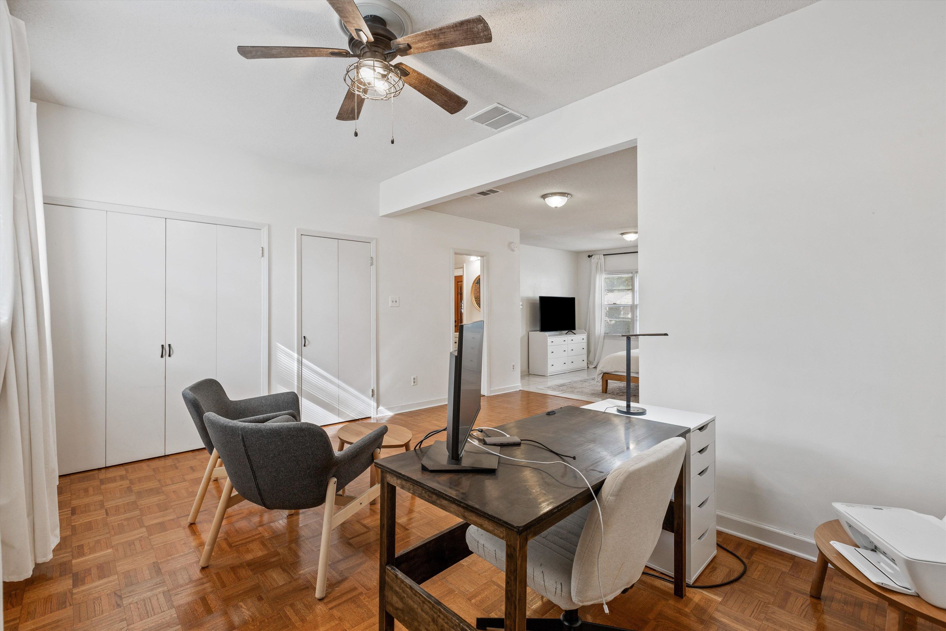 4506 Verne Road Memphis, TN 38117 - Photo 18 of 40 a view of a dining room with furniture and a chandelier fan