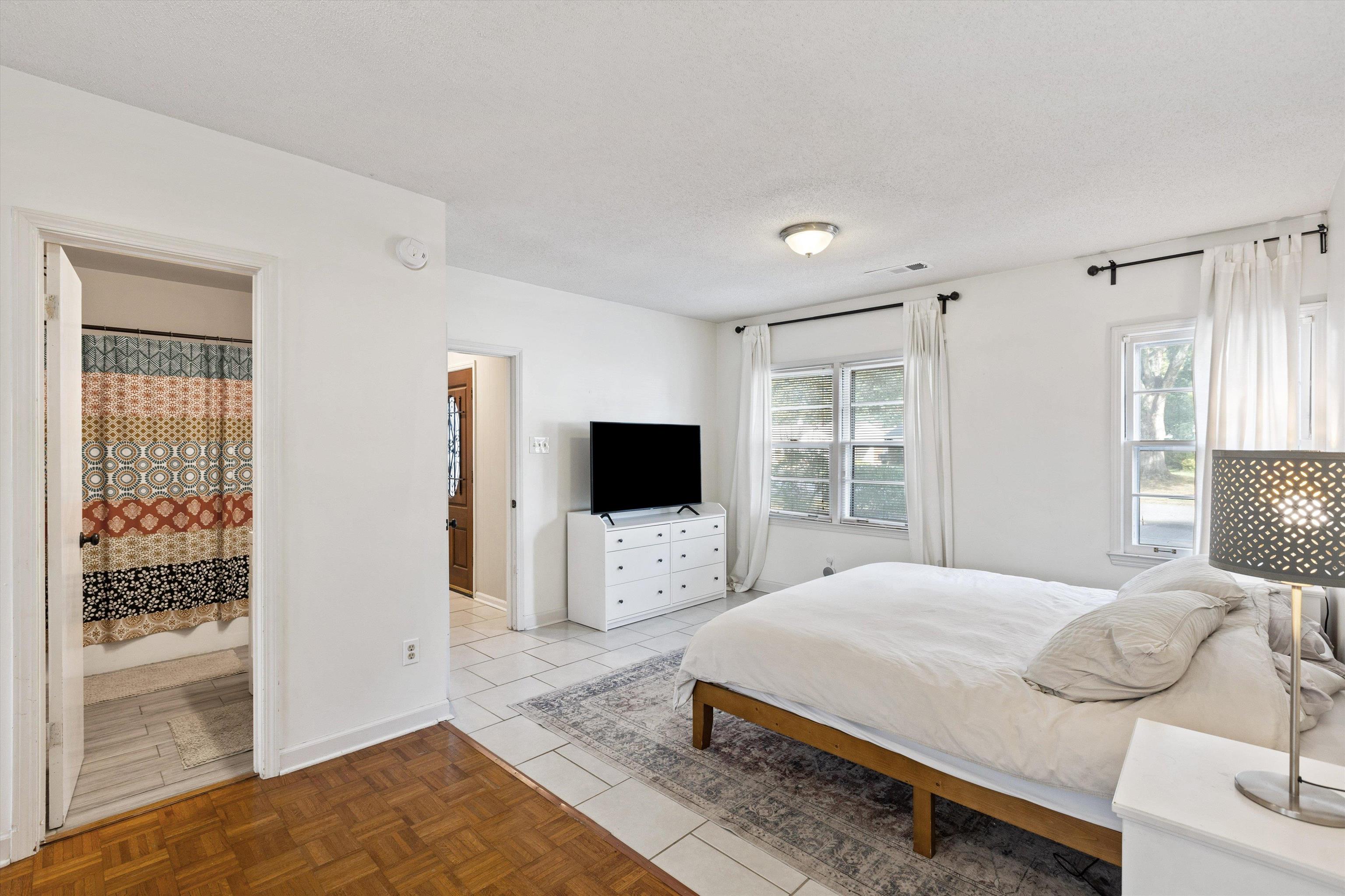 4506 Verne Road Memphis, TN 38117 - Photo 19 of 40 a bedroom with a bed and a flat screen tv