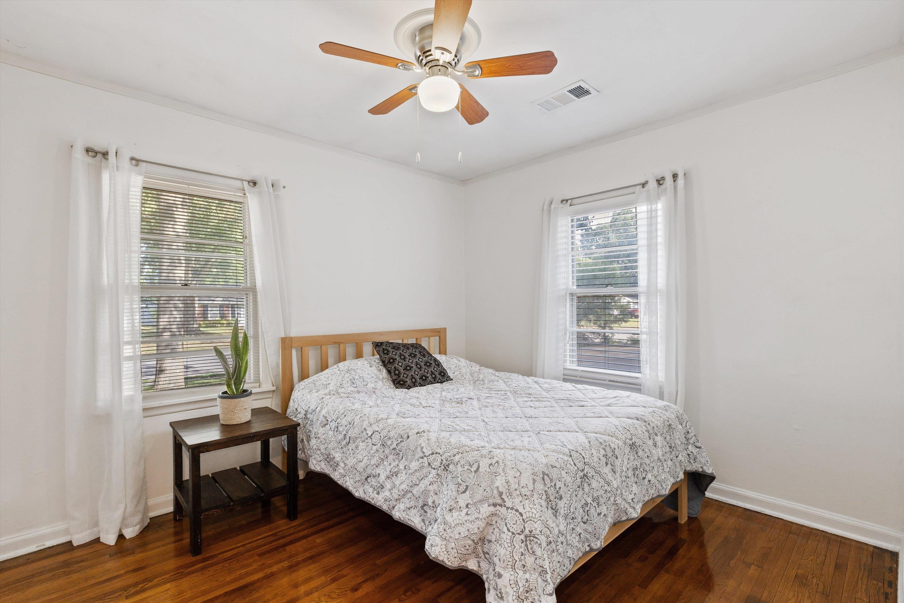 4506 Verne Road Memphis, TN 38117 - Photo 21 of 40 a bedroom with a bed a dresser and a window