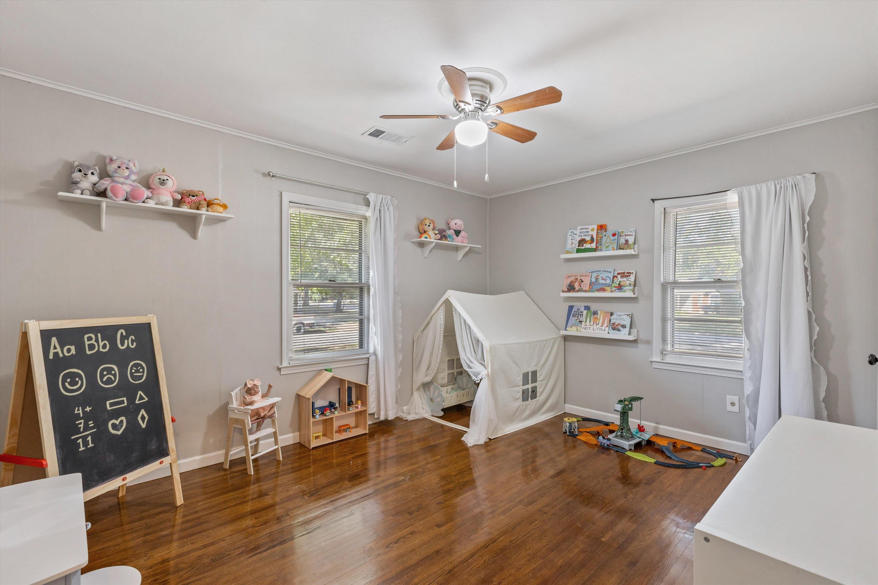 4506 Verne Road Memphis, TN 38117 - Photo 24 of 40 a view of a workspace with wooden floor and windows