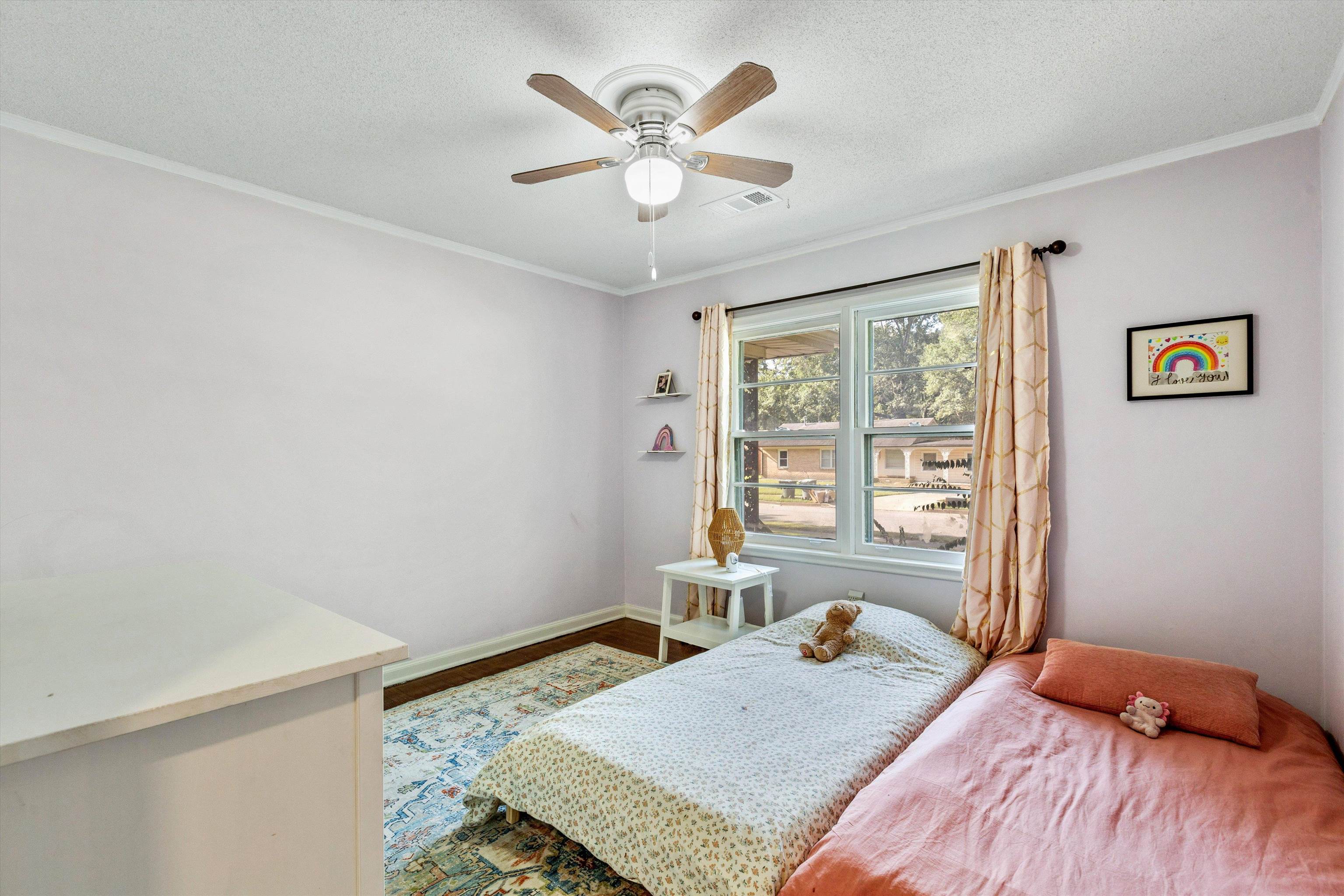 4506 Verne Road Memphis, TN 38117 - Photo 26 of 40 a bedroom with a bed and wooden floor