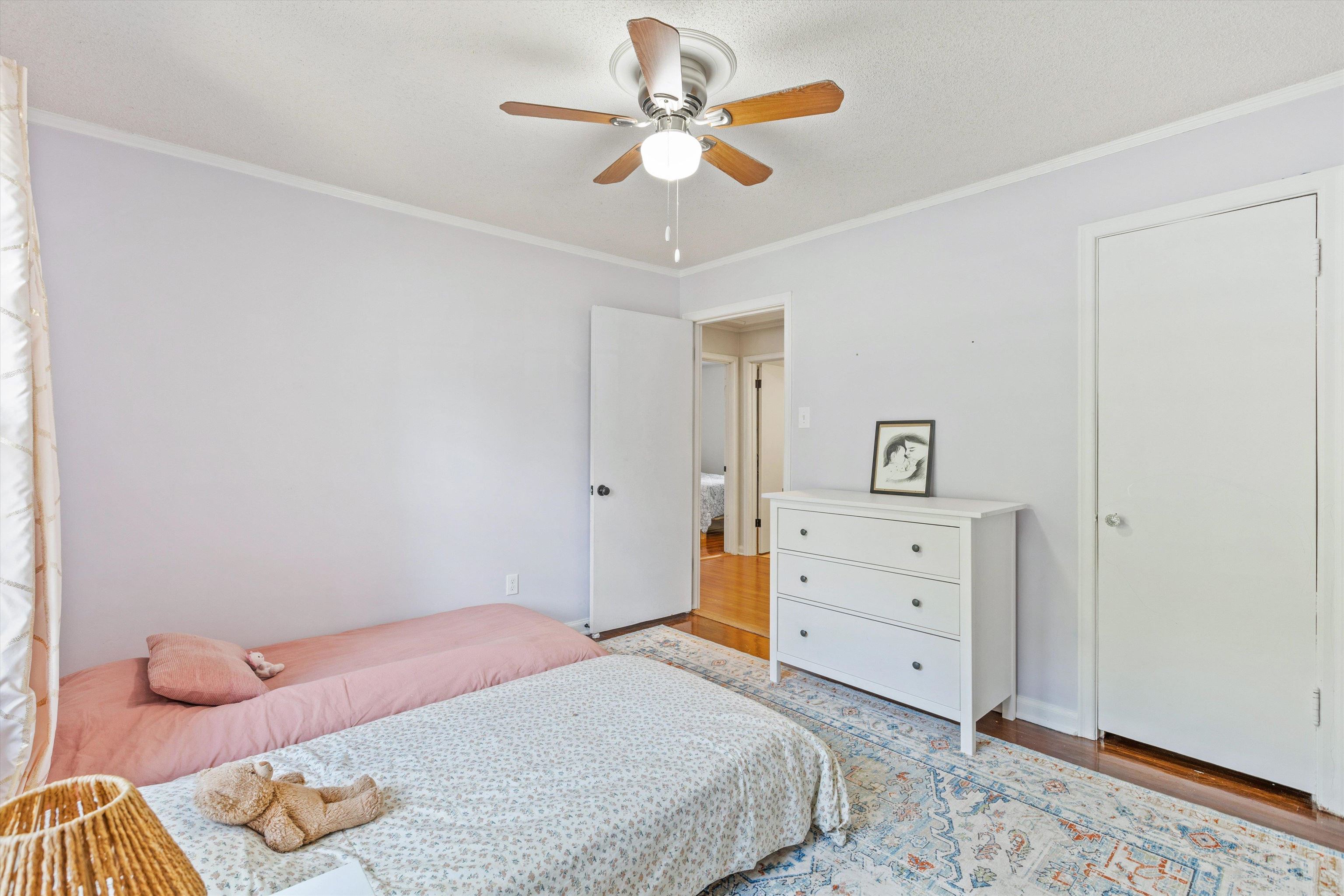 4506 Verne Road Memphis, TN 38117 - Photo 27 of 40 a bedroom with a bed and a dresser
