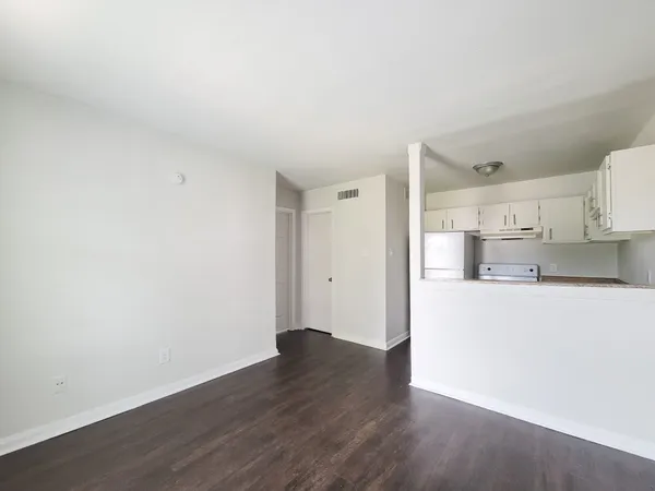 a view of kitchen with wooden floor