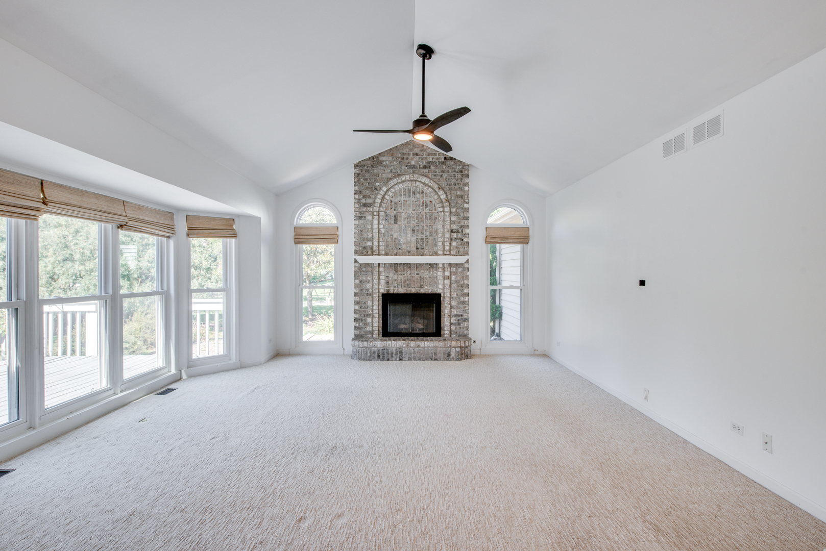 3631 Falkner Drive Naperville, IL 60564 - Photo 11 of 45 a view of an empty room with a fireplace and a window