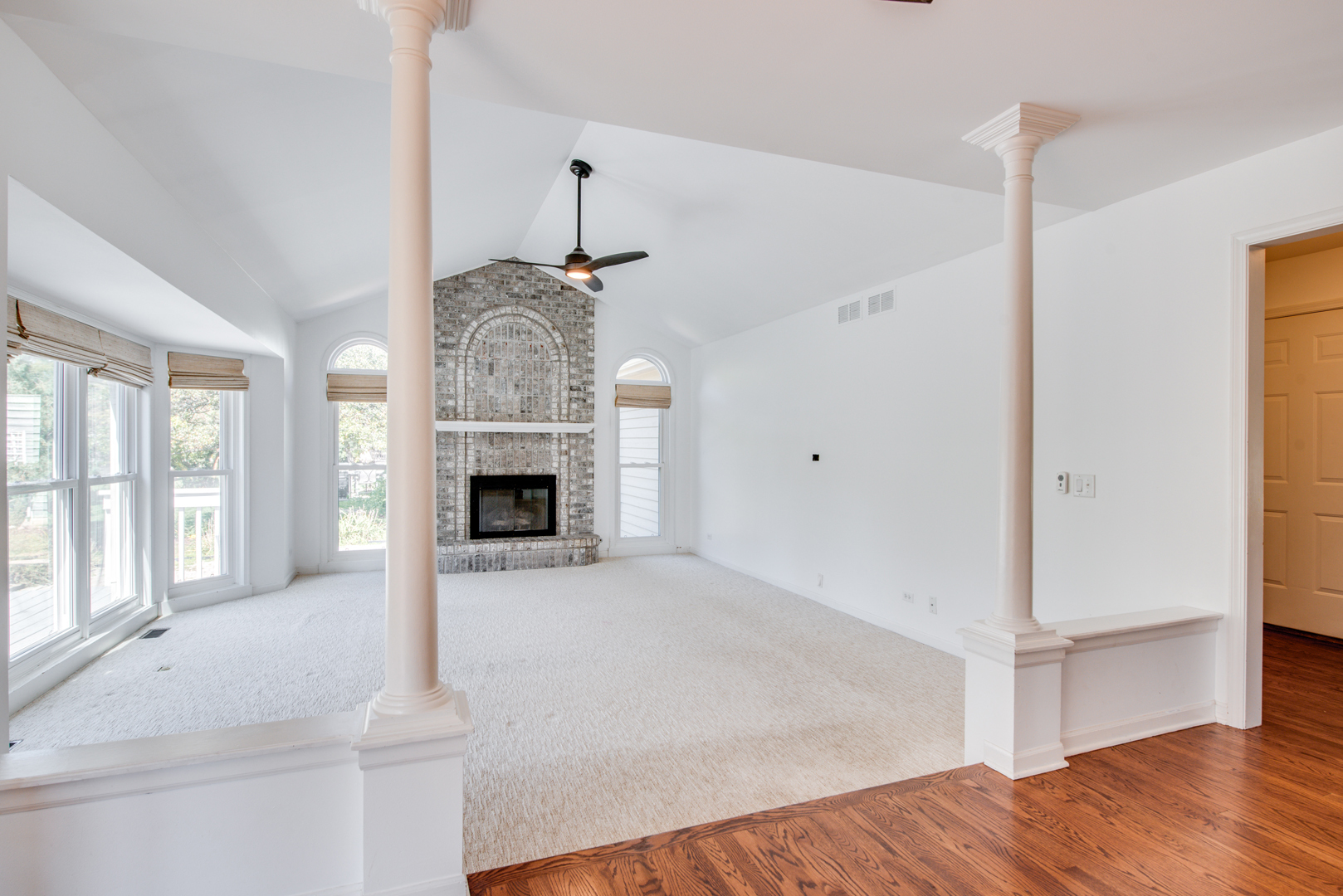 3631 Falkner Drive Naperville, IL 60564 - Photo 13 of 45 a view of an empty room with wooden floor fireplace and a window