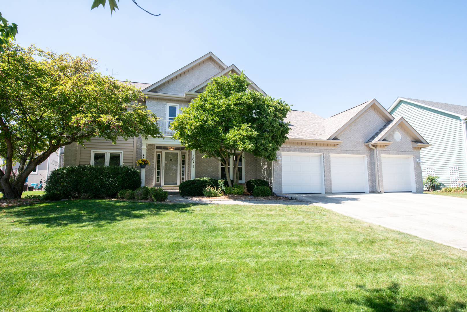 3631 Falkner Drive Naperville, IL 60564 - Photo 2 of 45 a front view of a house with a yard and garage