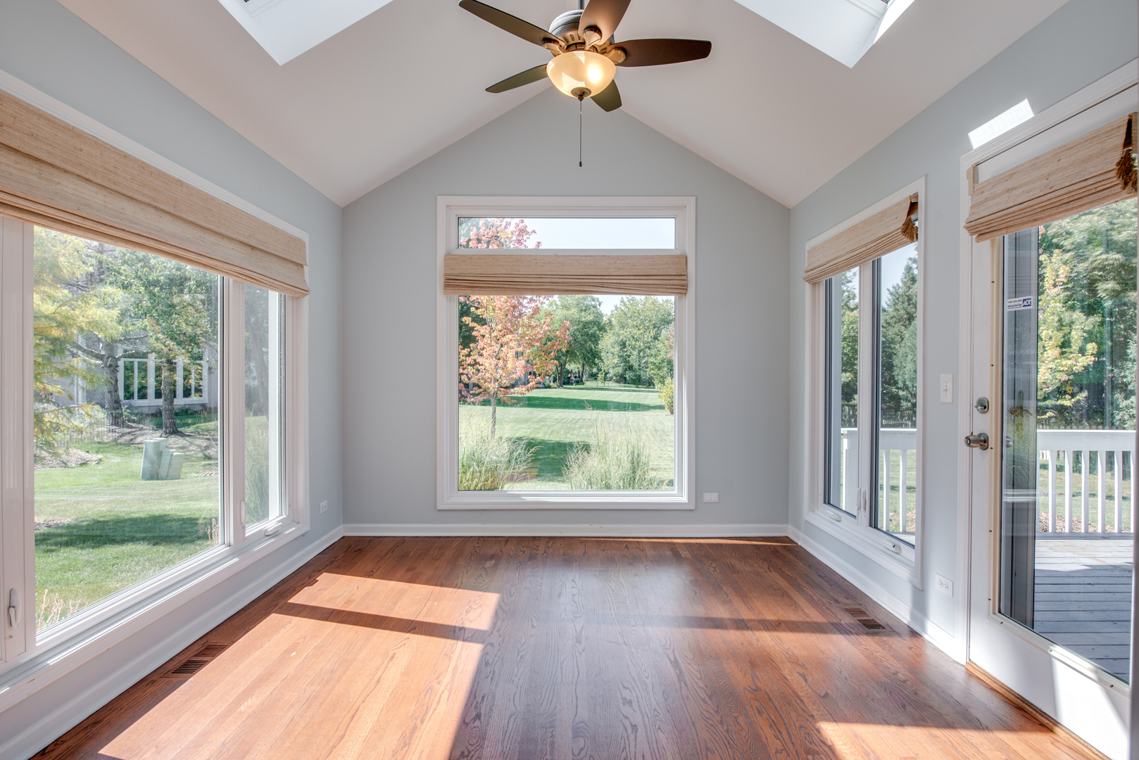 3631 Falkner Drive Naperville, IL 60564 - Photo 23 of 45 a view of a livingroom with a large window and wooden floor